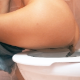 An Italian girl farts and takes a shit while sitting on a toilet. Poop action is clearly seen from this side to rear perspective. She wipes and shows us her dirty TP. Presented in 720P HD. Over 5 minutes.
